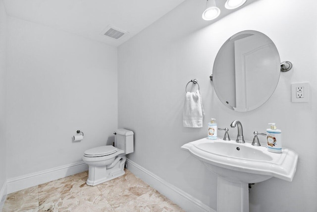 bathroom featuring sink and toilet