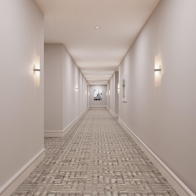 hall featuring light carpet