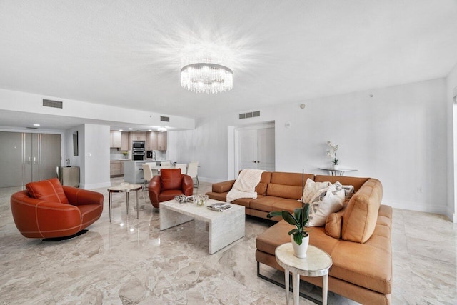 living room with a notable chandelier