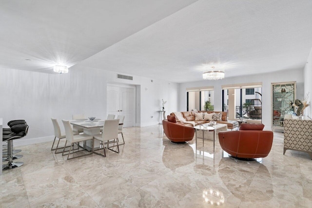 living room with an inviting chandelier