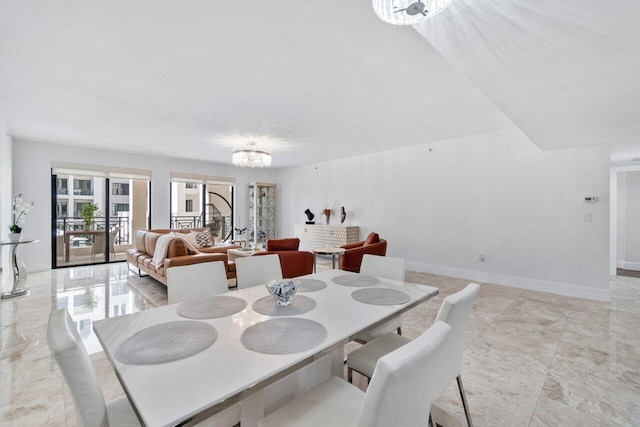 dining space with a chandelier