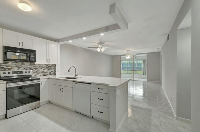 kitchen with stainless steel electric stove, dishwasher, sink, white cabinets, and kitchen peninsula