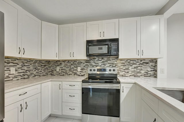 kitchen with white cabinetry, decorative backsplash, light tile patterned flooring, and stainless steel electric range