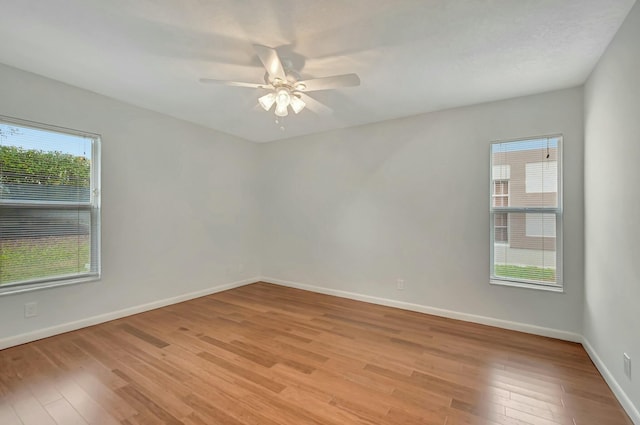 unfurnished room featuring light hardwood / wood-style flooring and ceiling fan