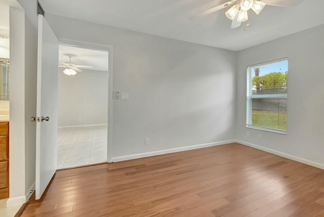 unfurnished room featuring ceiling fan and light hardwood / wood-style flooring