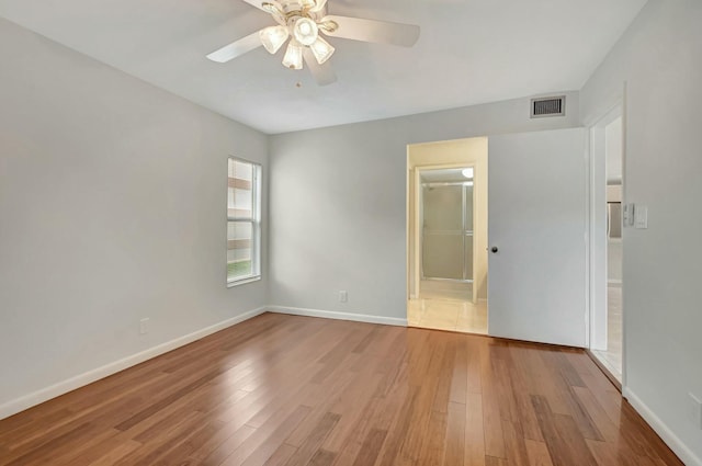 unfurnished room featuring ceiling fan and light hardwood / wood-style floors