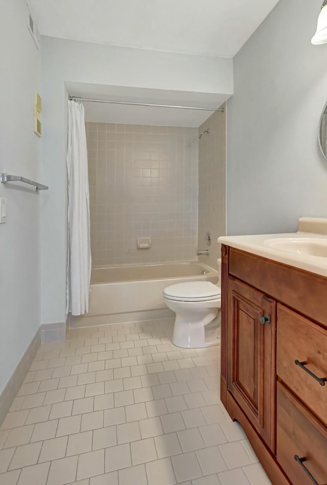 full bathroom featuring vanity, shower / tub combo, tile patterned floors, and toilet