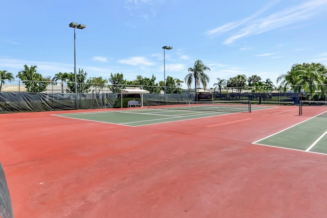 view of sport court with basketball hoop