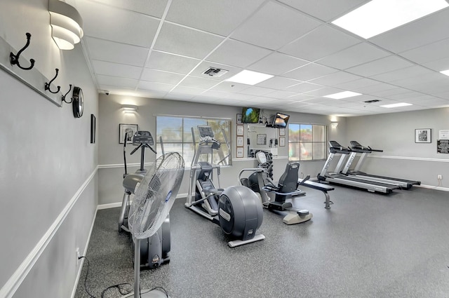 gym featuring a drop ceiling