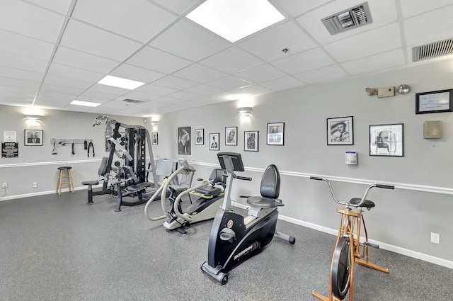 workout area featuring a paneled ceiling