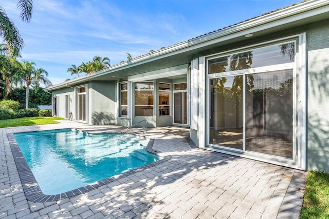 view of swimming pool with a patio