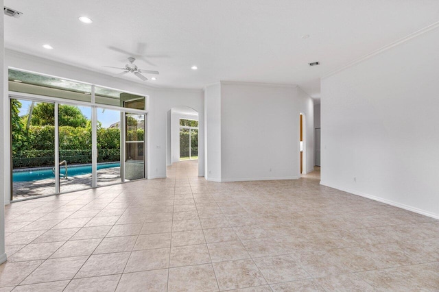 spare room featuring crown molding, ceiling fan, and light tile patterned flooring