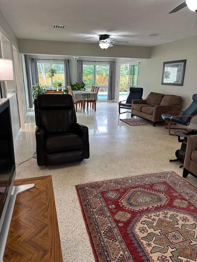 living room featuring ceiling fan