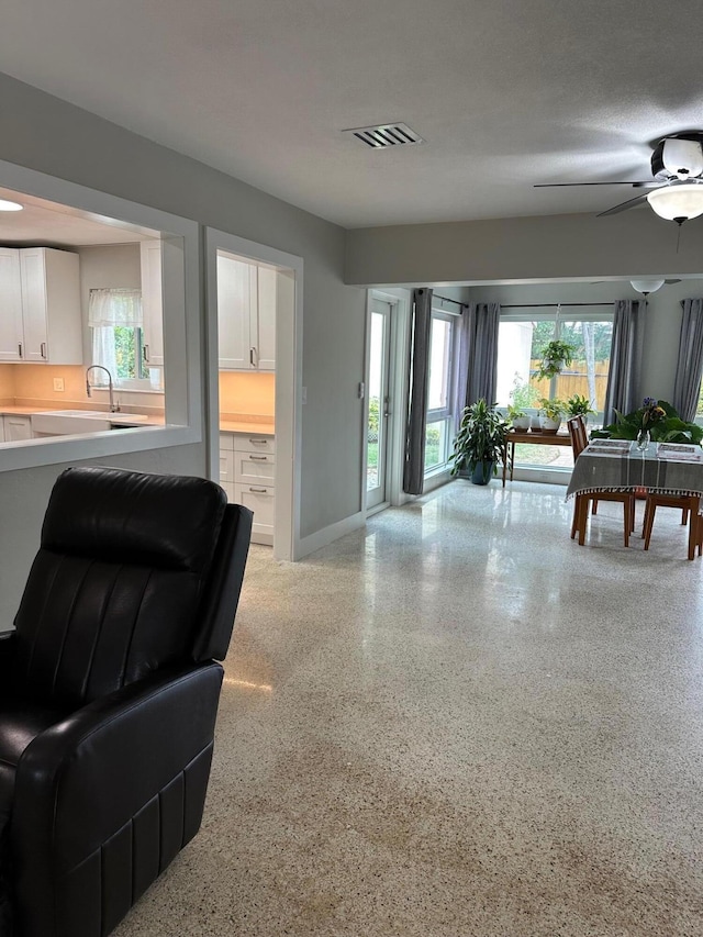 living room featuring ceiling fan