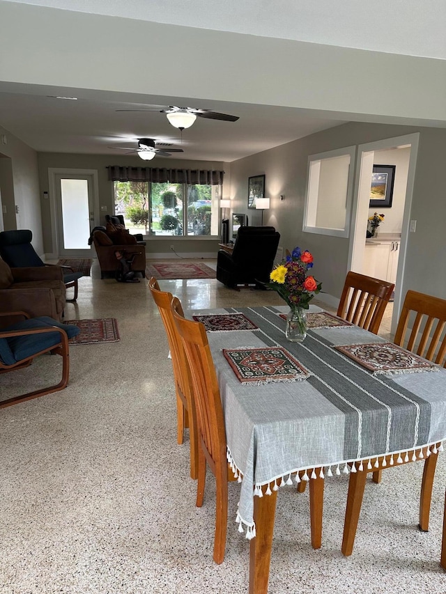 dining space with ceiling fan