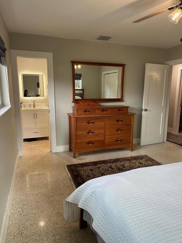 bedroom featuring ceiling fan and ensuite bathroom