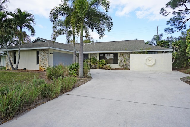 ranch-style house featuring a garage