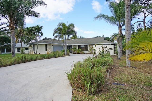 ranch-style home featuring a garage