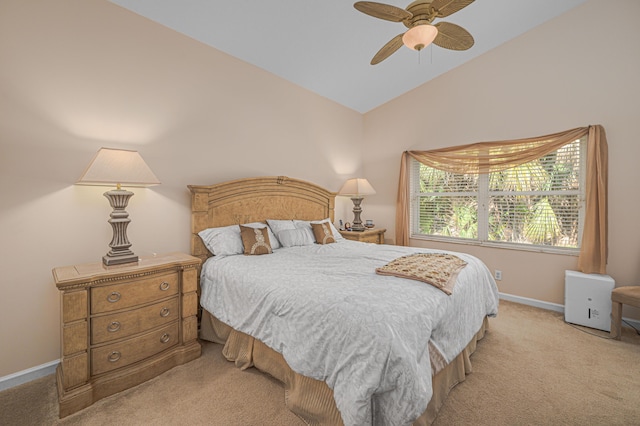 carpeted bedroom with ceiling fan and lofted ceiling