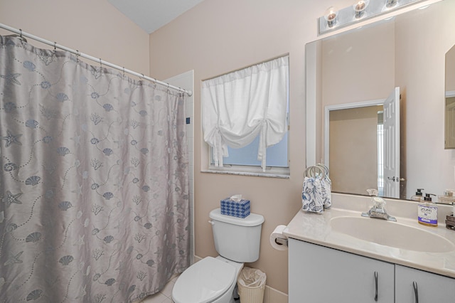 bathroom featuring vanity, toilet, and a shower with shower curtain