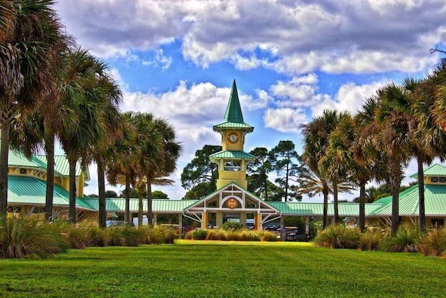 view of home's community with a yard