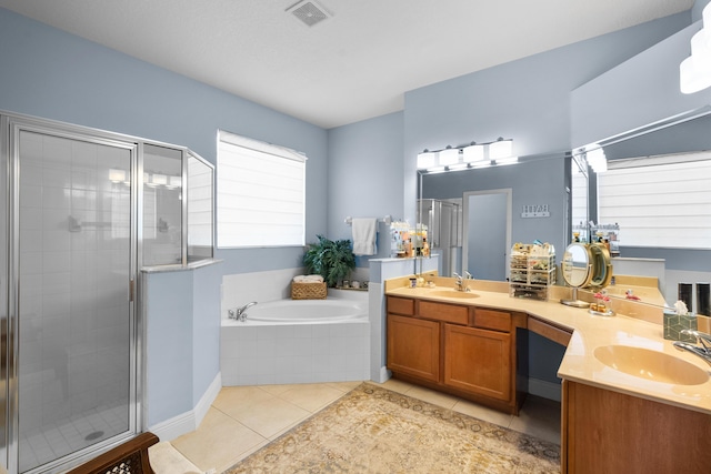 1915 SW Panther Trce, Stuart, FL 34997 - bathroom with a sink, visible vents, a stall shower, a garden tub, and tile patterned flooring