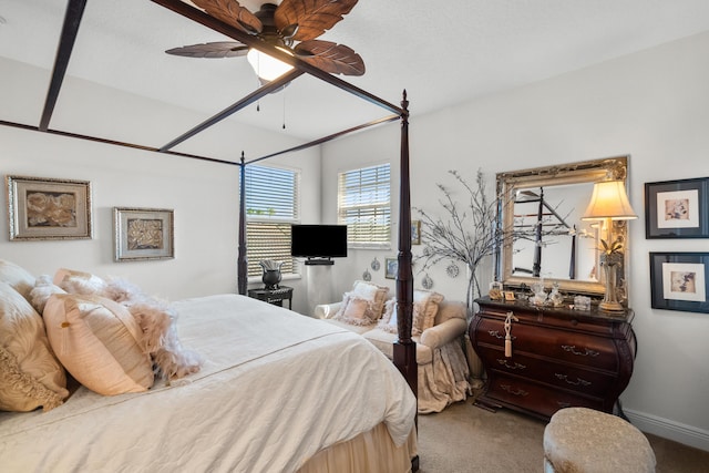 bedroom featuring ceiling fan and carpet