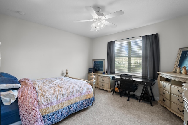 bedroom with light colored carpet and ceiling fan