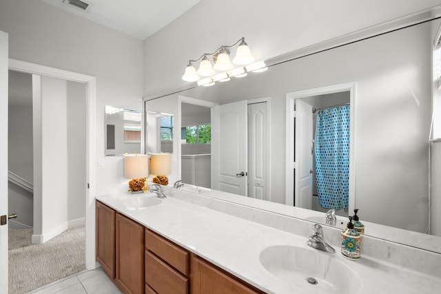 1915 SW Panther Trce, Stuart, FL 34997 - full bath featuring visible vents, tile patterned flooring, double vanity, and a sink