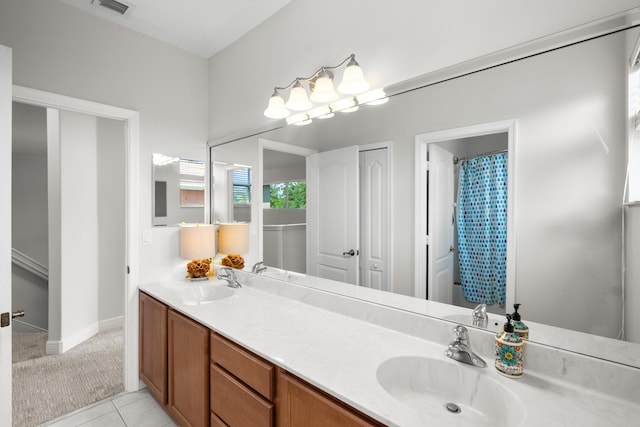 bathroom featuring tile patterned floors and vanity