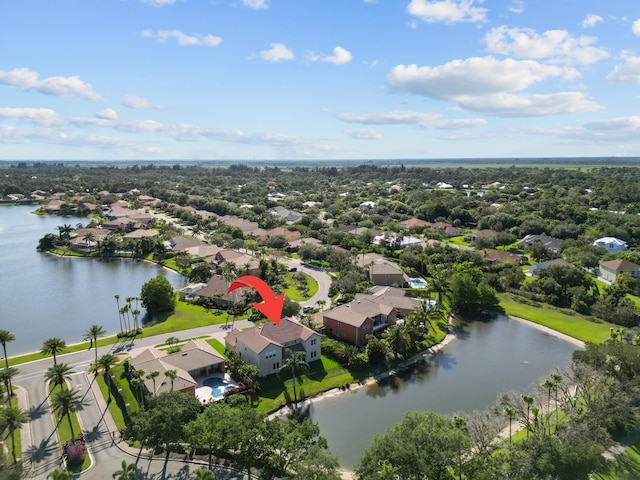 birds eye view of property featuring a water view