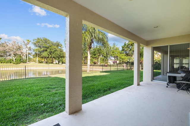 view of patio featuring a water view