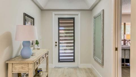 entryway with light hardwood / wood-style floors