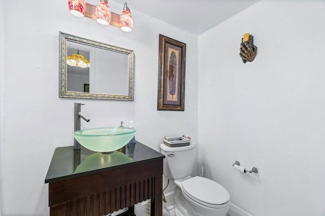 bathroom with toilet and vanity