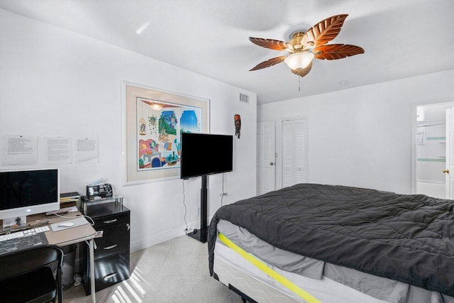 bedroom featuring ceiling fan and ensuite bath