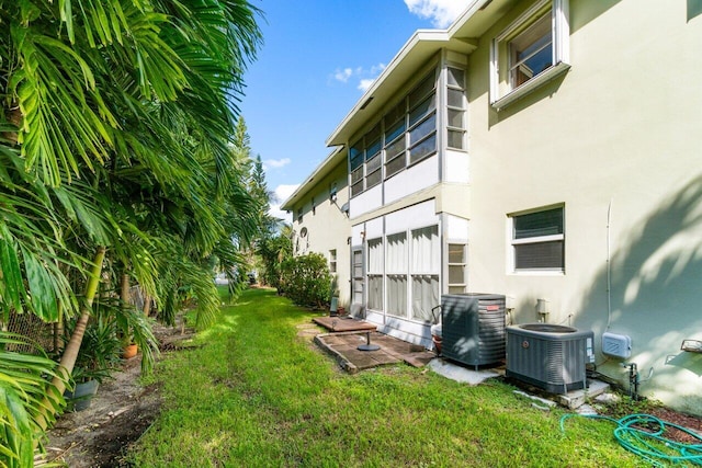 view of yard featuring central AC