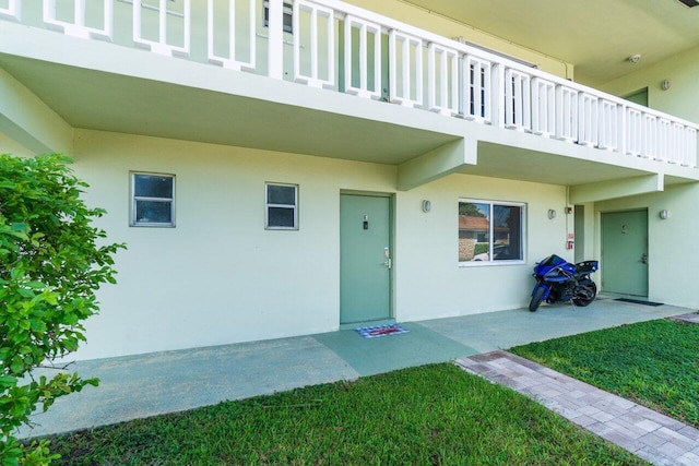 doorway to property featuring a balcony