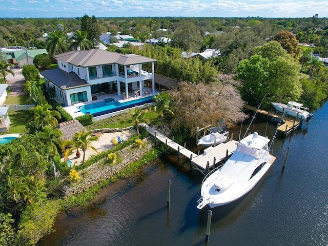 birds eye view of property featuring a water view