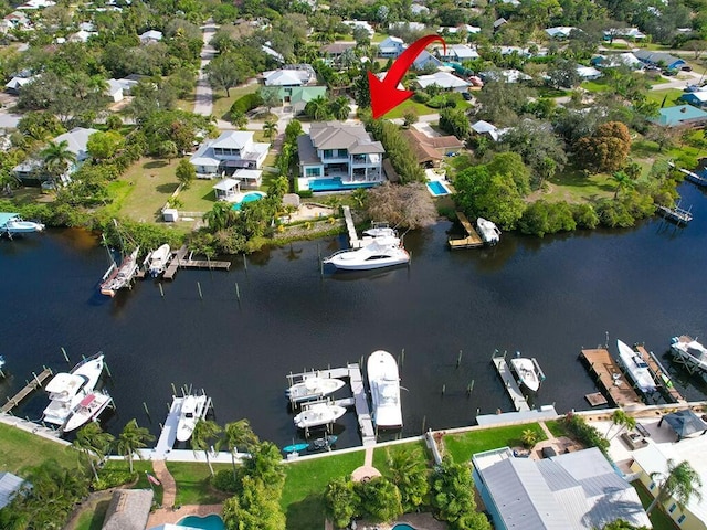 birds eye view of property featuring a water view