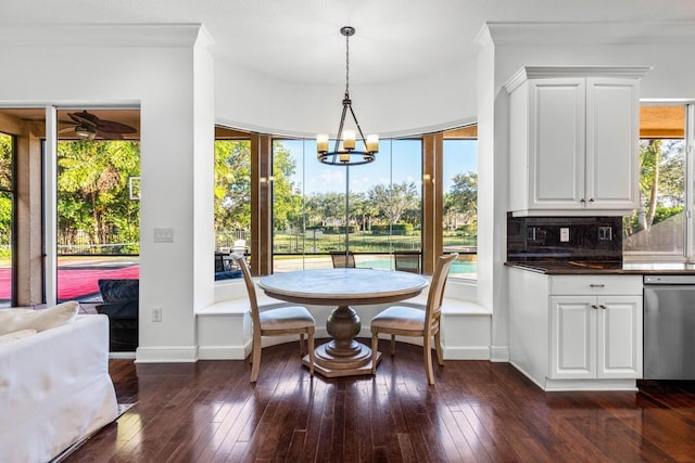 dining area featuring dark hardwood / wood-style flooring and a healthy amount of sunlight