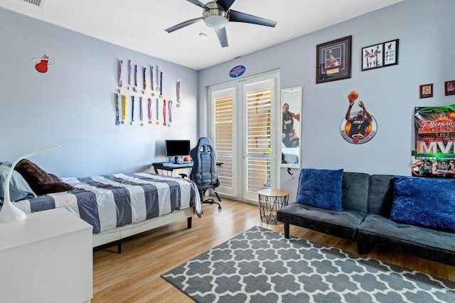 bedroom featuring hardwood / wood-style flooring and ceiling fan