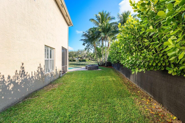 view of yard with a fenced in pool