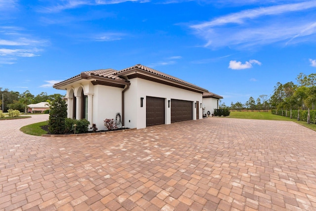 view of property exterior featuring a garage