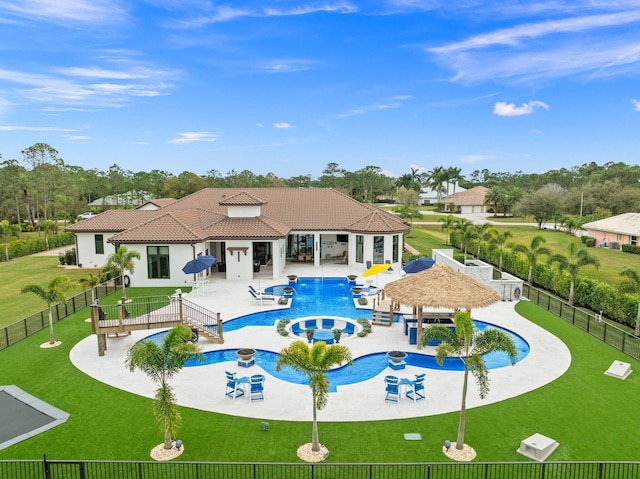 view of pool with a patio, a yard, and a gazebo