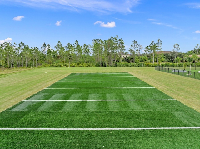 view of property's community featuring a lawn