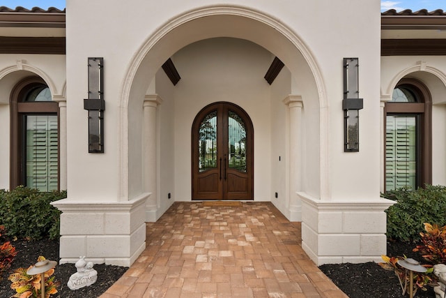 entrance to property featuring french doors