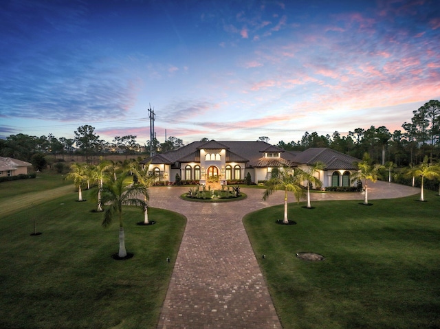 view of front of home with a lawn