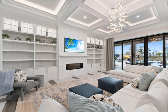 living room with an inviting chandelier, coffered ceiling, built in features, and crown molding