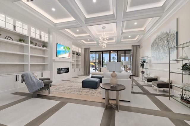 living room featuring built in features, an inviting chandelier, coffered ceiling, ornamental molding, and beamed ceiling