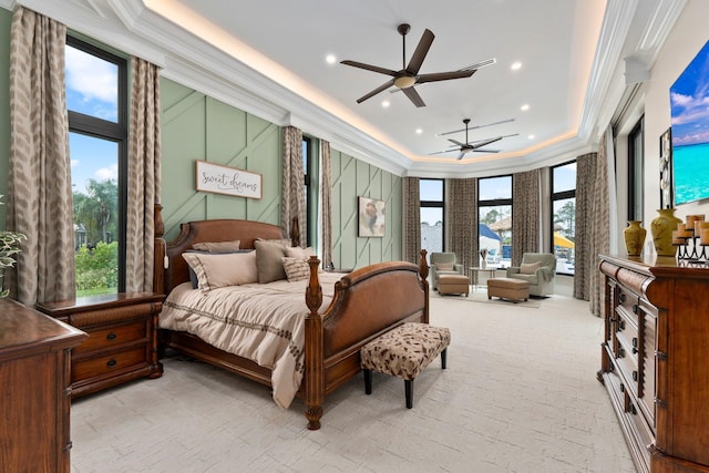 bedroom featuring ornamental molding, light carpet, and ceiling fan